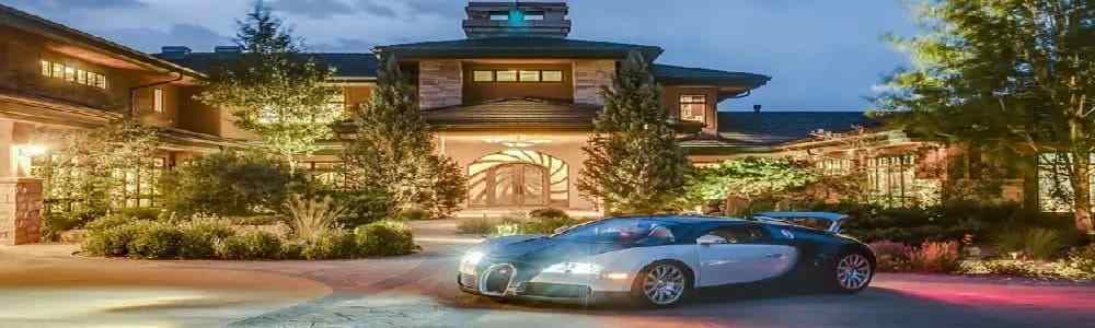 A luxurious home with a luxury car in the driveway, Attain House, Car, Boat, And More Via Money Spell.